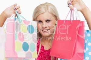 Beautiful blonde showing shopping bags