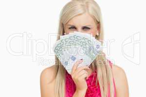 Beauty holding 100 euros banknotes