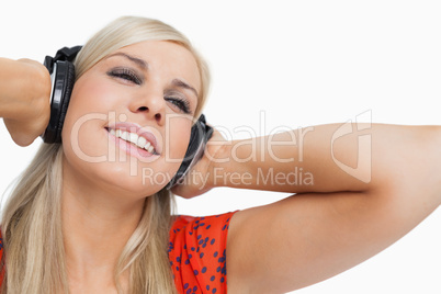 Happy blonde listening to music