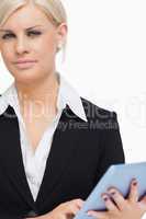 Green eyed businesswoman holding a tactile tablet