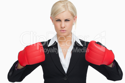 Serious businesswoman wearing red gloves