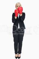 Blonde businesswoman with red gloves