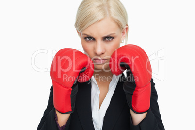 Combative woman with red gloves fighting