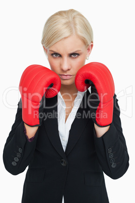 Serious woman wearing red gloves