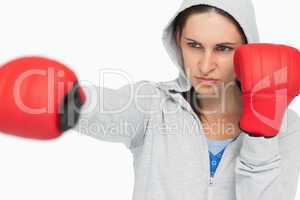 Brunette in sweatshirt boxing