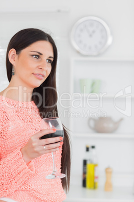 Beautiful brunette holding a glass of wine