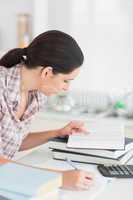 Woman working on a book