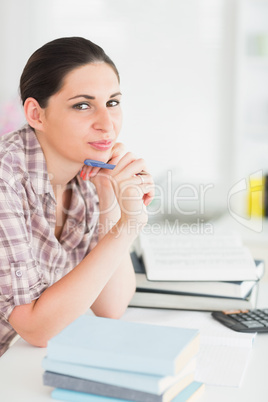 Woman thinking over books