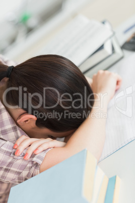 Tired woman leaning her head on the table