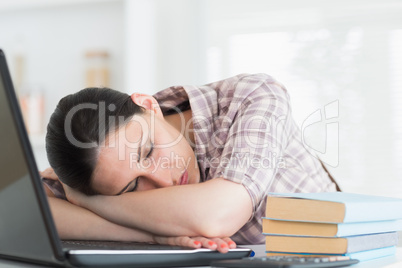 Woman resting on laptop