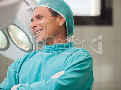 Surgeon smiling with arms crossed