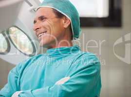 Surgeon smiling with arms crossed