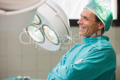 Happy surgeon sitting in a operating room