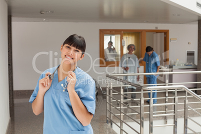 Laughing doctor standing in the hallway