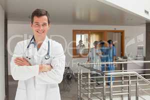 Laughing doctor standing in the hall