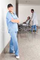 Proud nurse standing in the hallway