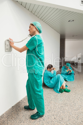 Surgeon using the phone