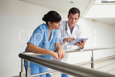 Doctor explaining some exercises to a nurse