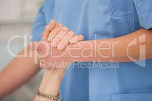 Nurse holding hands of the elderly lady