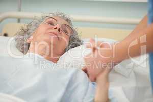 Nurse caring about old woman