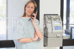 Femalepatient on hold on telephone