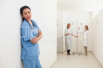 Nurse feeling sad with doctor talking to patient