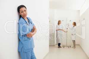 Nurse feeling sad with doctor talking to patient