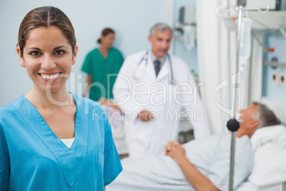 Happy nurse  in hospital room