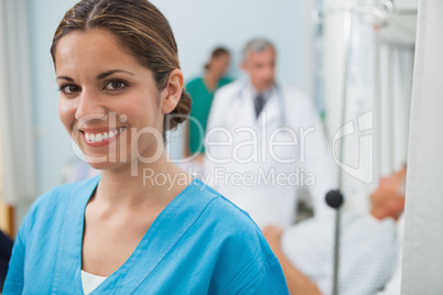 Smiling nurse in hospital room