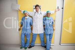 Happy doctor  between two smiling nurses