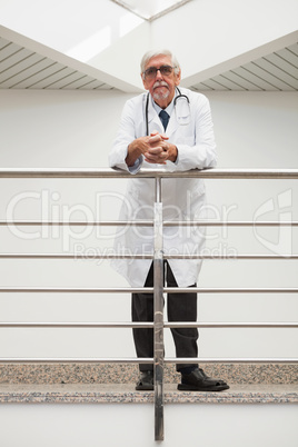 Doctor  leaning on the railing