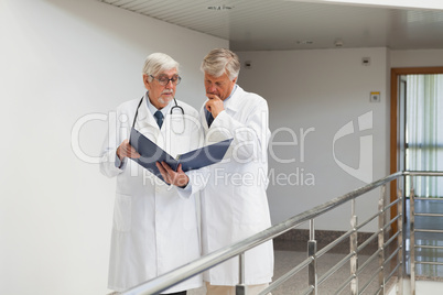 Doctors standing in the corridor talking