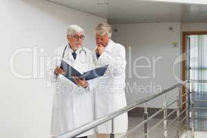 Doctors standing in the corridor talking