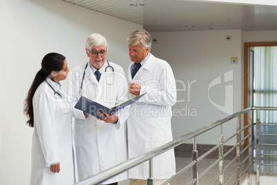 Three doctors talking