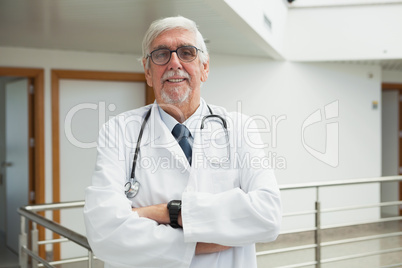 Doctor standing in the corridor smiling