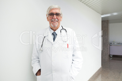 Happy doctor in corridor