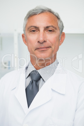 Smiling doctor wearing labcoat