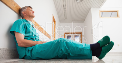 Doctor sitting on the floor