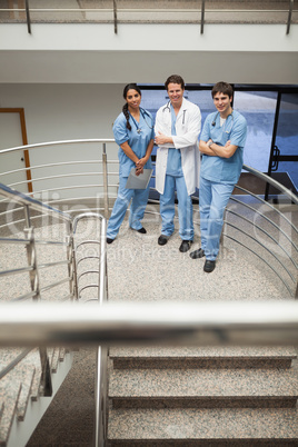 Doctor and two nurse standing on the stairs