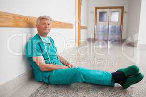 Doctor sitting on the floor smiling