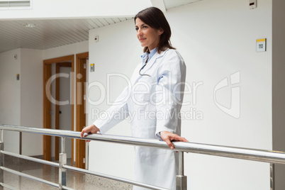 Doctor is standing at the railing