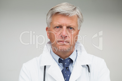 Mature doctor looking serious