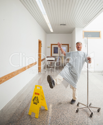 Patient pretending to slip on wet floor