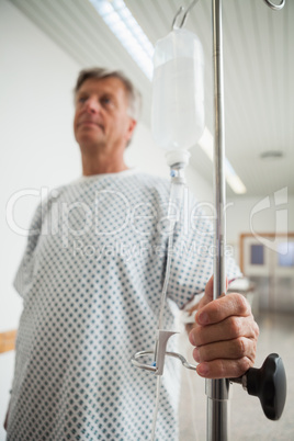 Patient holding onto IV drip
