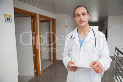 Smiling doctor holding a folder