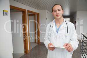 Smiling doctor holding a folder