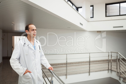 Doctor on stairwell looking ahead