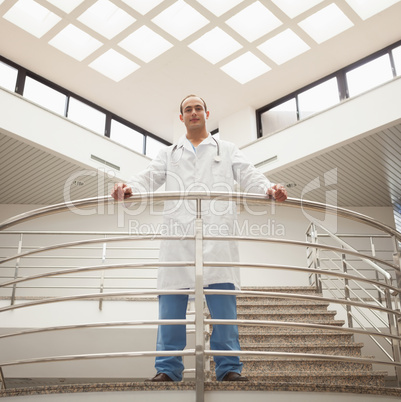 Doctor looking down from stairwell