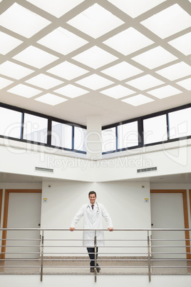 Doctor leaning on the stairwell