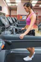 Woman resting on the treadmill after exercising